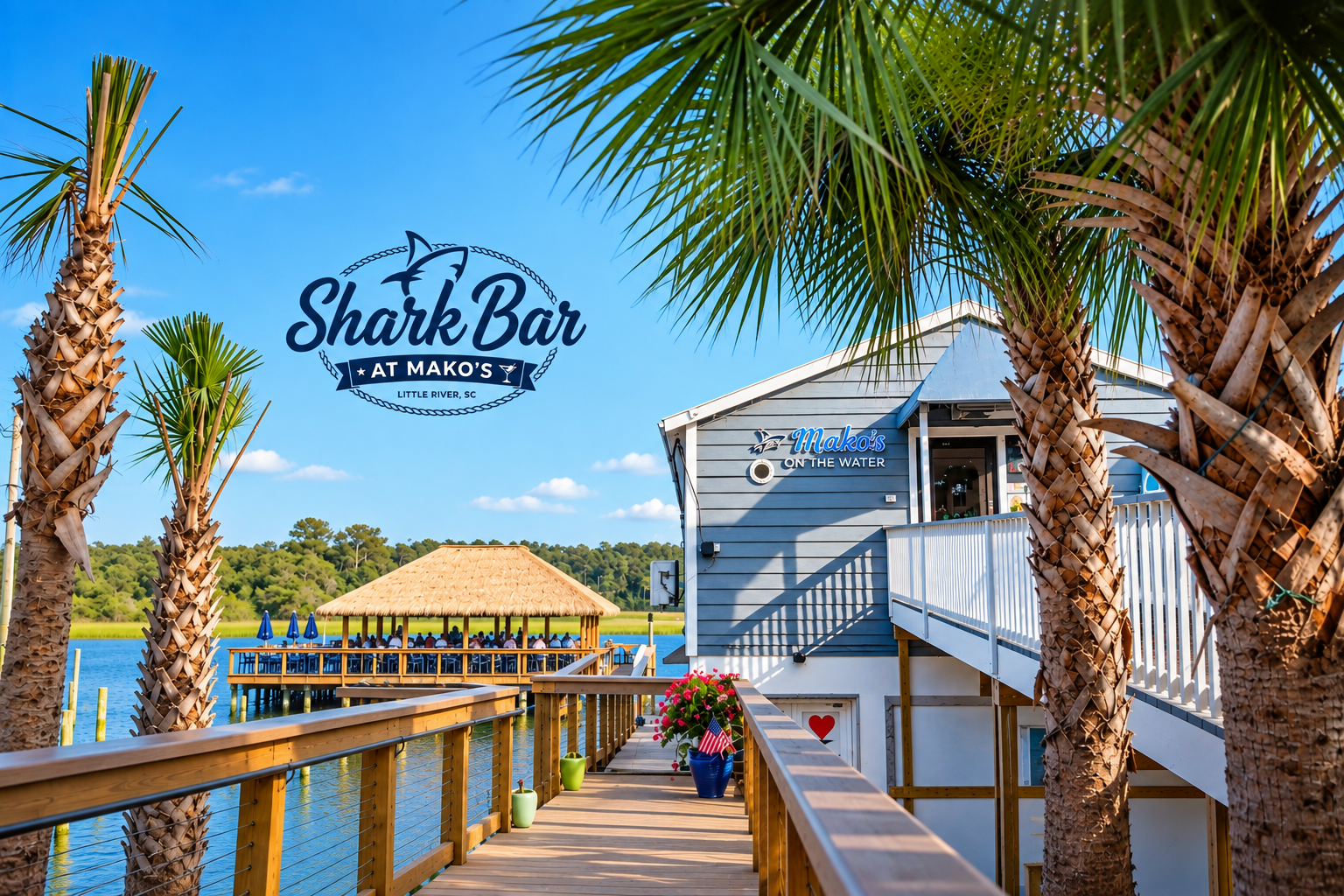 view from entrance to Makos on the water with the shark bar beyond with logo